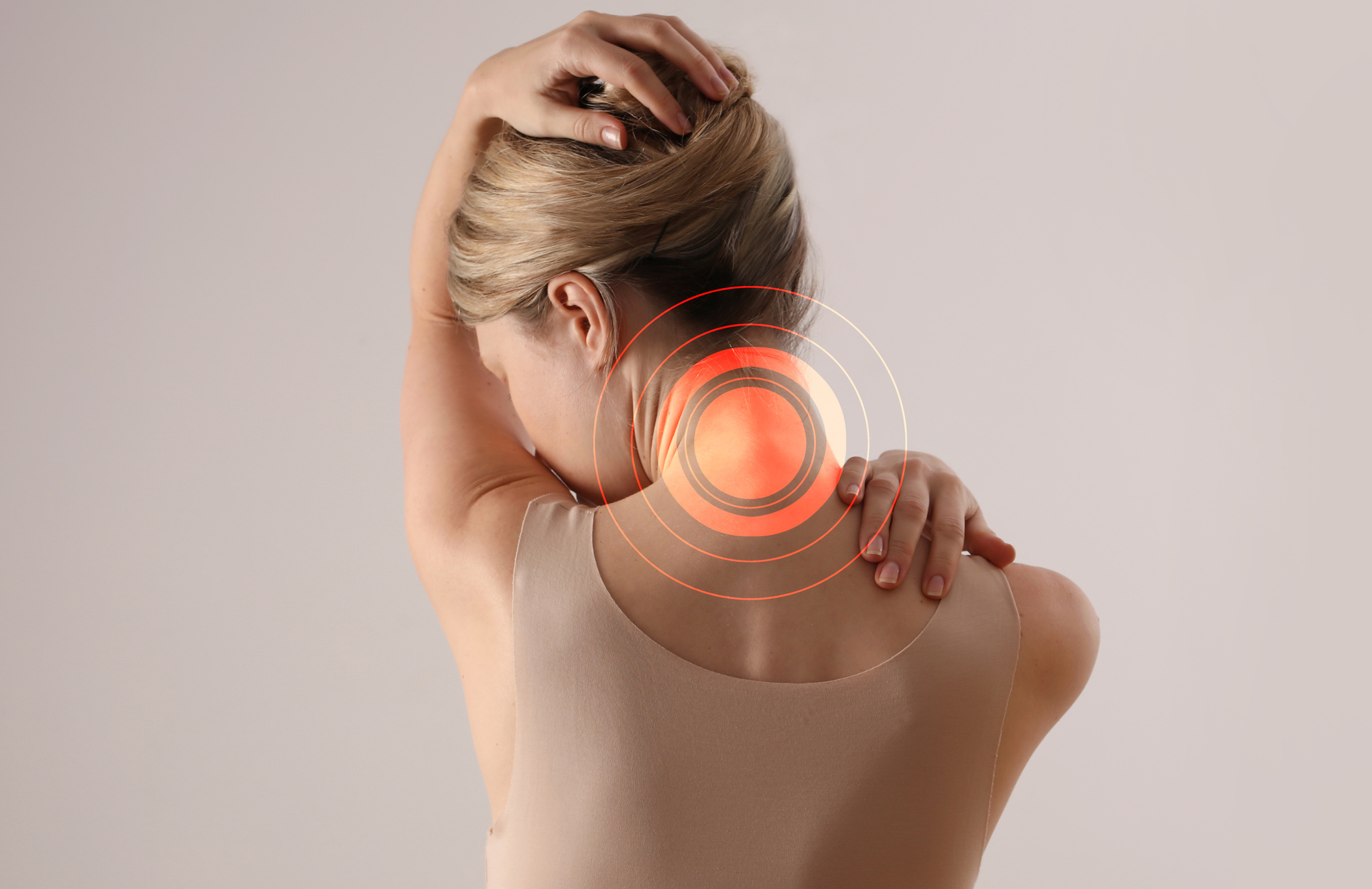 Woman sufferingfrom back and neck pain. Chiropractic, Physiotherapy concept